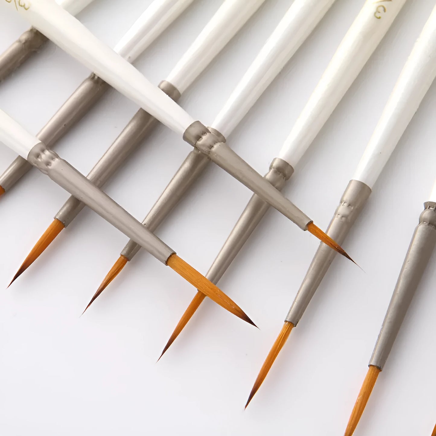 Set of 12 pearl white nylon wool hook line art brushes in a solid wood pen holder.