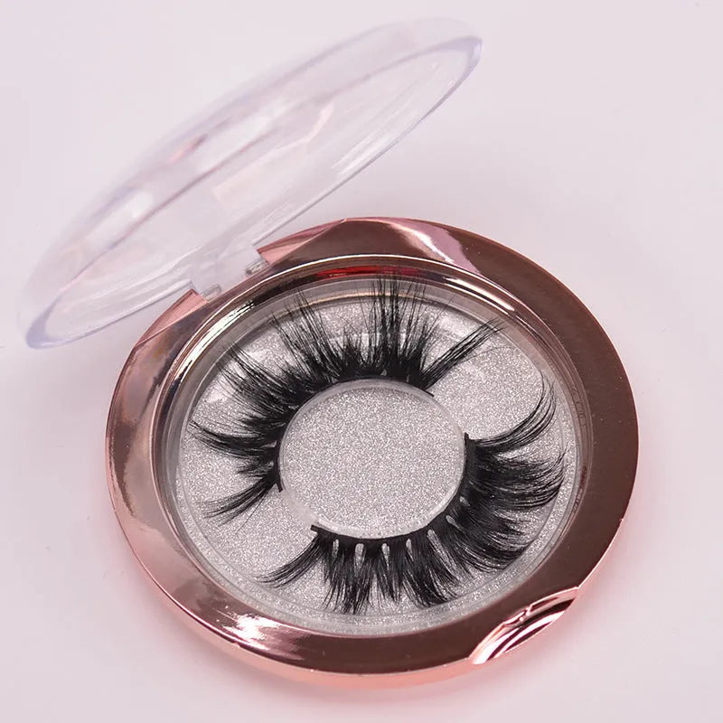 Affectionate brand 5D mink false eyelashes with a hair cap and double-headed brush on a pink background.