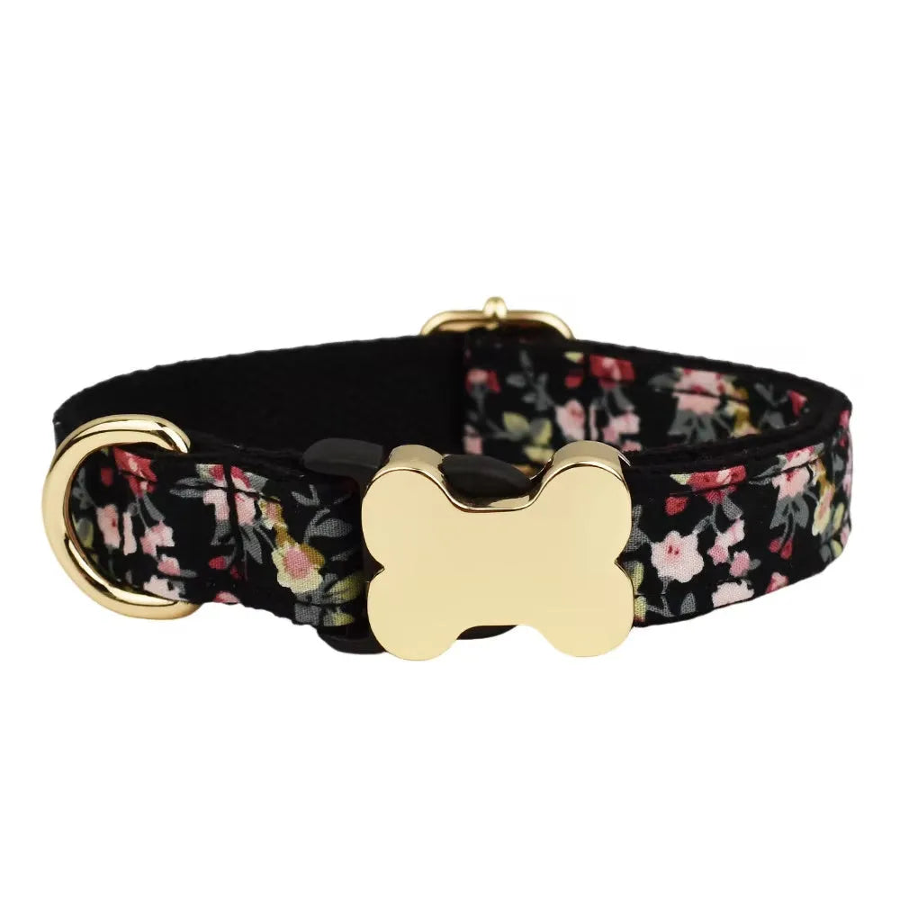 Flat nylon grid print dog collar with a white plastic bone-shaped buckle on a green background.