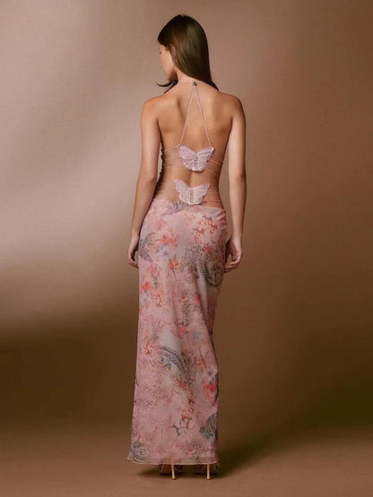 A stylish halter dress with a floral print and butterfly-inspired back, perfect for summer events and parties.