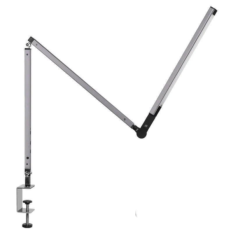 Adjustable aluminium desk lamp with remote control, shown in black with a clip attached to a desk edge.