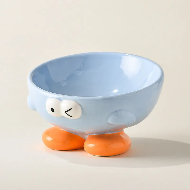 Ceramic slanted pet bowl with decorative expression pattern in blue colour