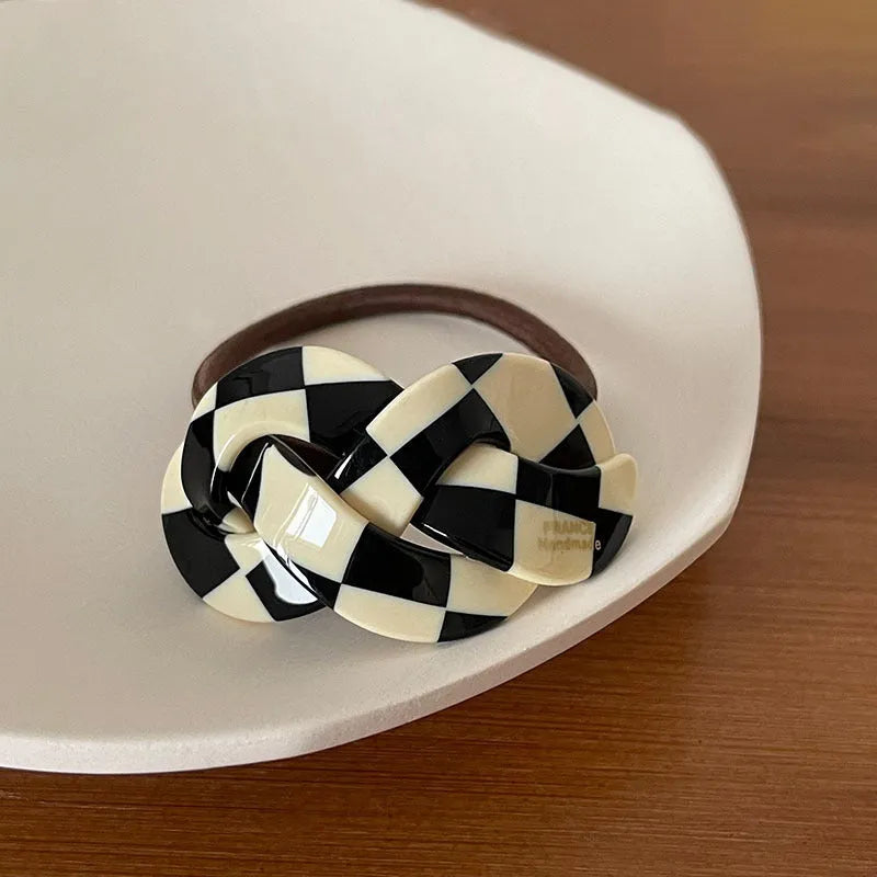 Seamless acetate hair rope ring in black, plaid, caramel, and dark coffee colours.