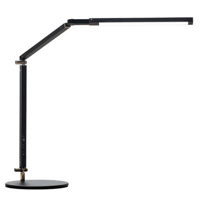 Adjustable aluminium desk lamp with remote control, shown in black with a clip attached to a desk edge.