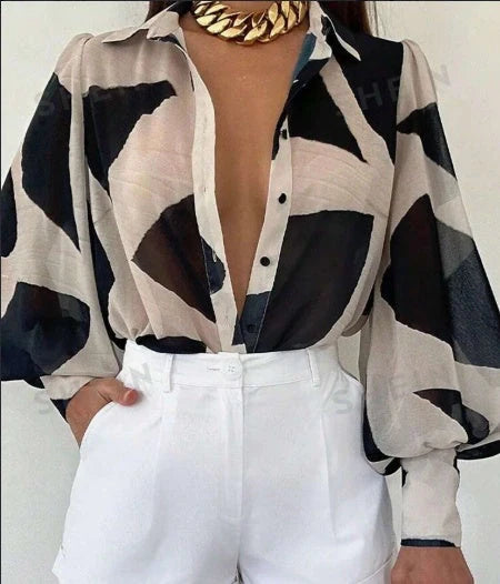 Elegant floral blouse with lantern sleeves, perfect for spring and summer fashion