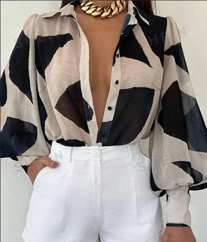 Elegant floral blouse with lantern sleeves, perfect for spring and summer fashion