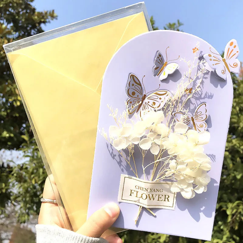 Handmade 3D butterfly greeting card with stand-up artificial flowers on coated paper, 16x10.5cm