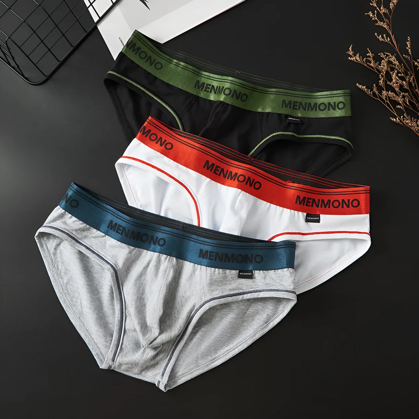 Men's cotton low waist briefs in a two-tone colour on a white background.