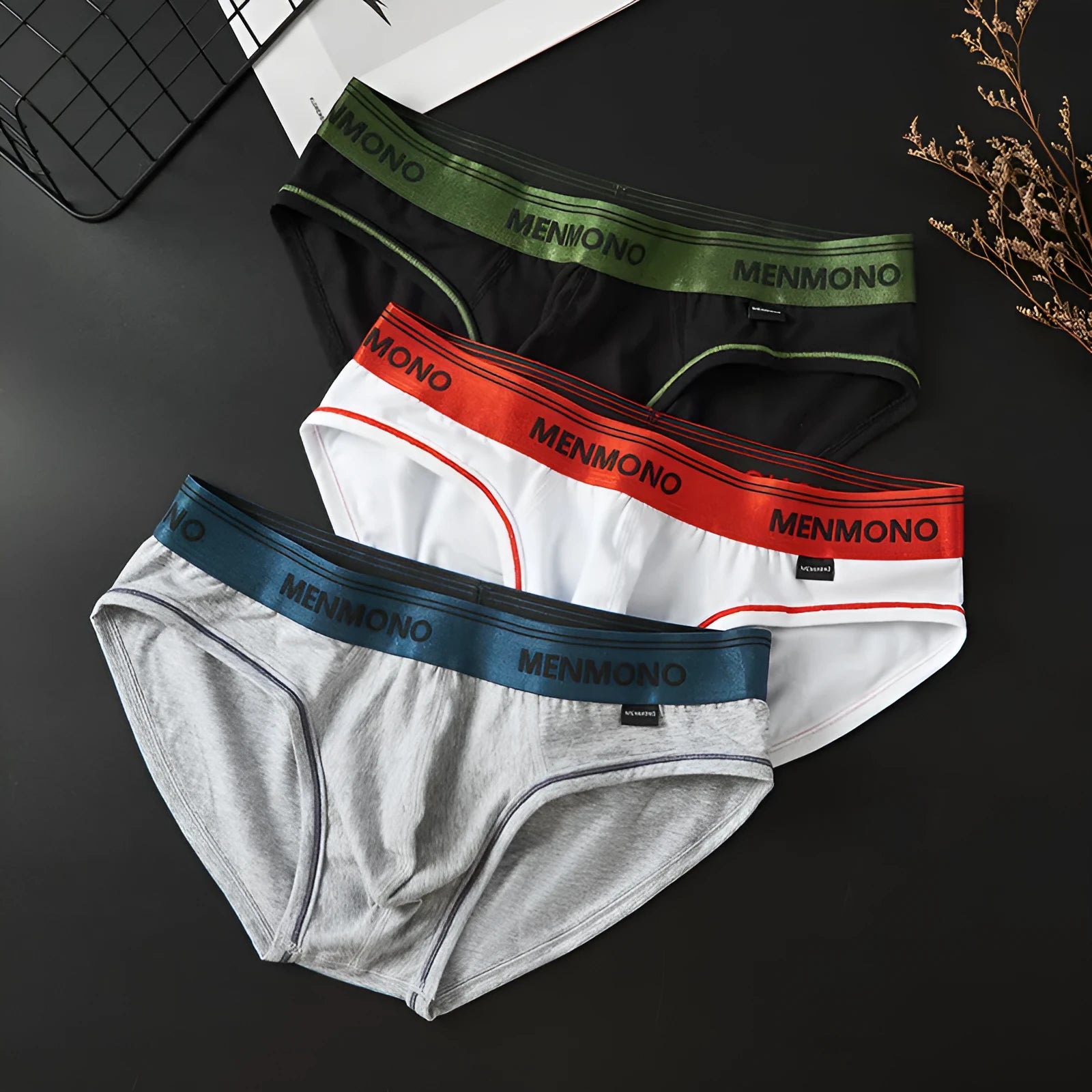 Men's cotton low waist briefs in a two-tone colour on a white background.