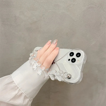 Transparent TPU iPhone case with love bracelet heart chain design on a mobile phone.
