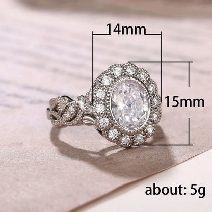 Round zircon ring with geometric design in F1770 white gold colour plating, available sizes 6 to 10