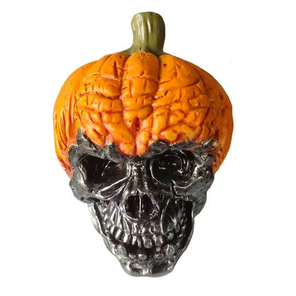Hand-painted pumpkin skull resin ornament measuring 12cm tall with orange and black colour scheme