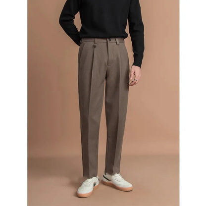 Men's straight-leg casual trousers in draped polyester fabric, shown in khaki colour on a hanger.
