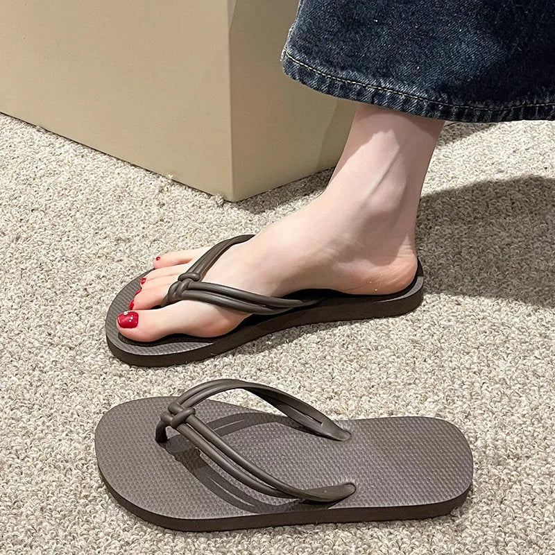 Men's PVC toe-covering flip-flop slippers on a white background, showing the injection moulded sole and available colour options.