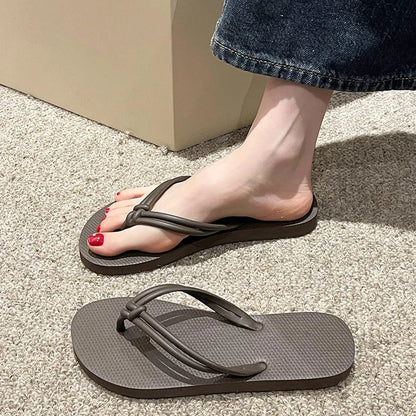 Men's PVC toe-covering flip-flop slippers on a white background, showing the injection moulded sole and available colour options.