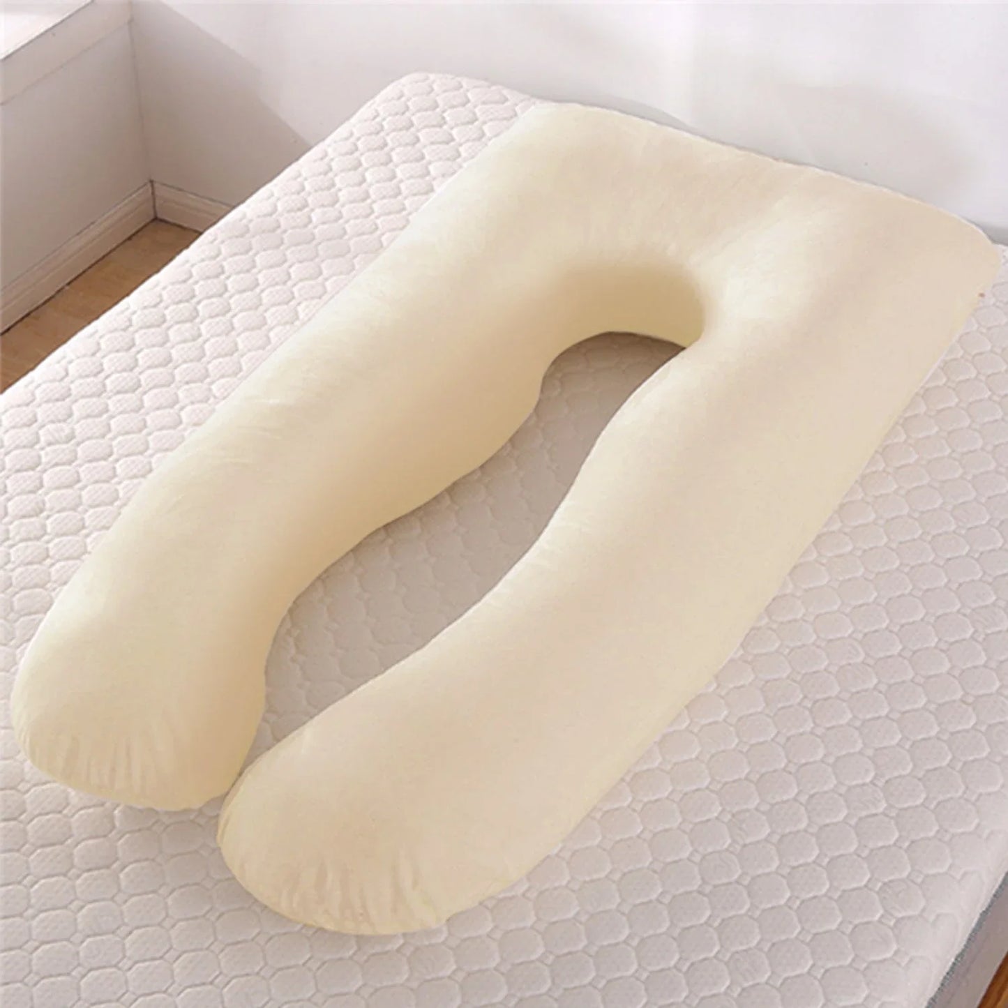 Premium U-shaped pregnancy pillow with pure cotton exterior and polyester fiber filling, designed to provide soothing support and refreshing coolness for expectant mothers.