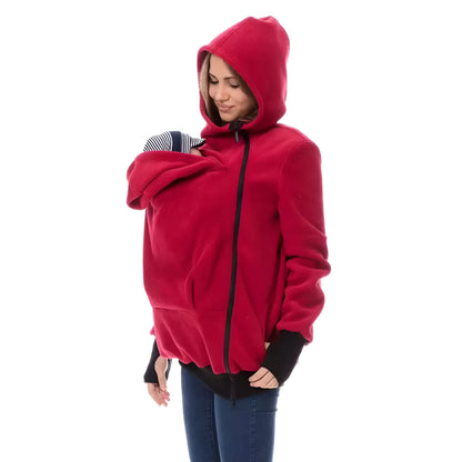 Red loose fit women's polar fleece sweater with long sleeves on a hanger