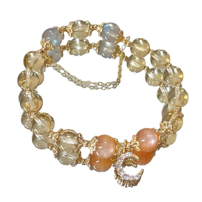 Women's gold electroplated crystal bracelet with moonstone and sunstone stones in Chinese style design.