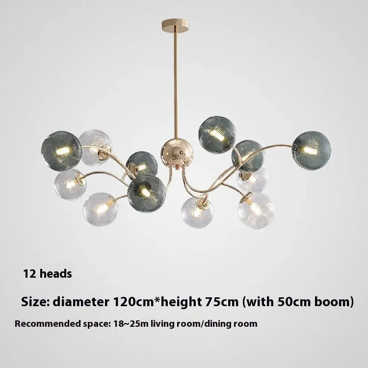 Modern Nordic-style chandelier with multiple green glass shades hanging at different heights.