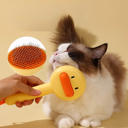 Small yellow duck-shaped plastic comb for grooming cats and dogs, with open needle teeth.