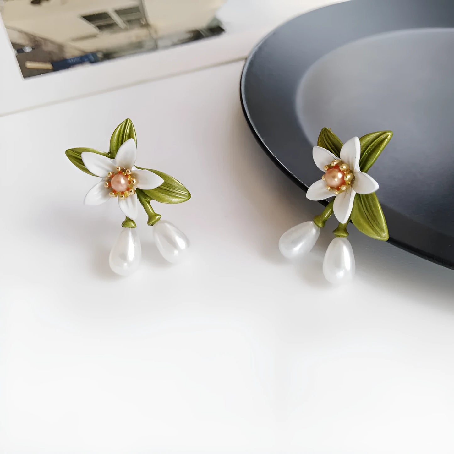 Alloy flower earring set with sterling silver needle detailing showing both stud and clip styles