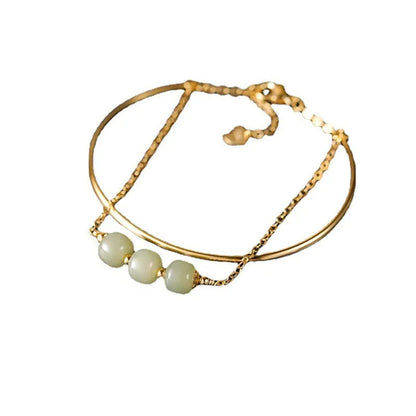 Women's Hetian jade lucky beads bracelet with gold inlay, shown in faux two-piece design.