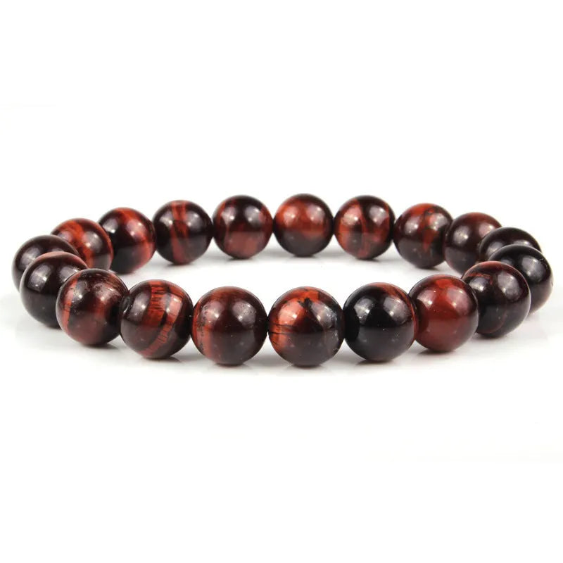 Natural tiger eye crystal bead bracelet showing round geometric beads on a wrist, available in multiple sizes and colour variations.