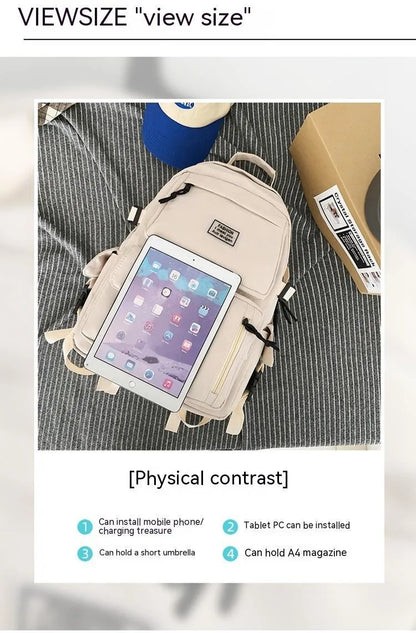 Black and white nylon student backpack with laptop compartment and three-dimensional pocket.