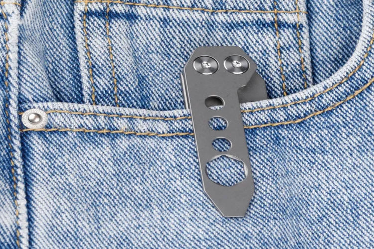 Titanium alloy multi-function crowbar tool with bottle opener on a stone wash finish background.