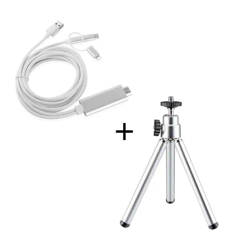 Black mini camera tripod with extended legs and a separate U-shaped universal phone clip on a table.