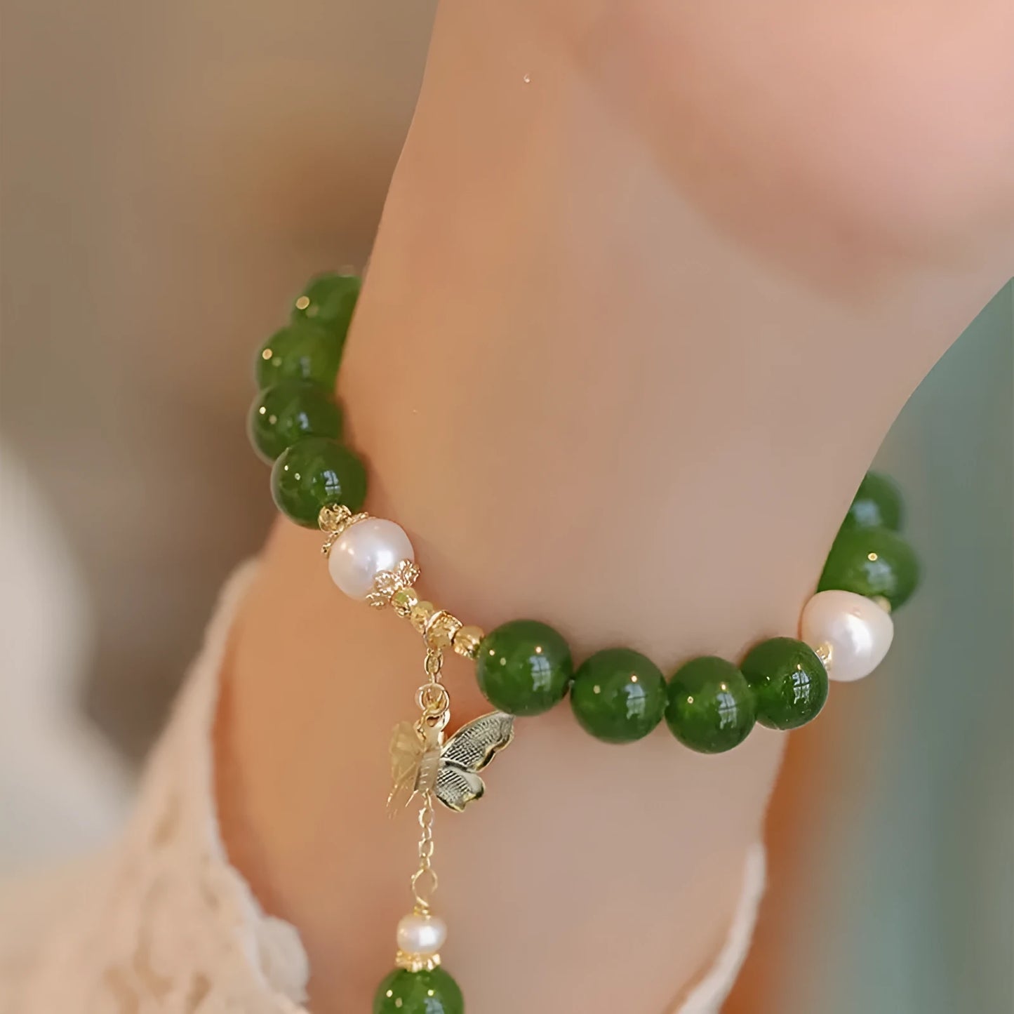 Natural green chalcedony stone bracelet with round beads in geometric arrangement