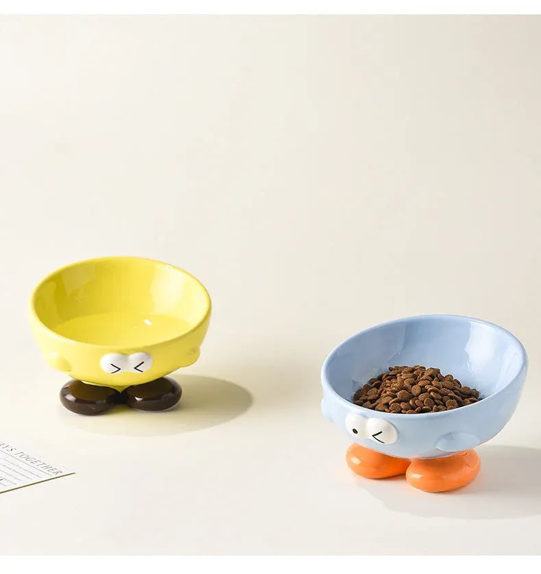 Ceramic slanted pet bowl with decorative expression pattern in blue colour