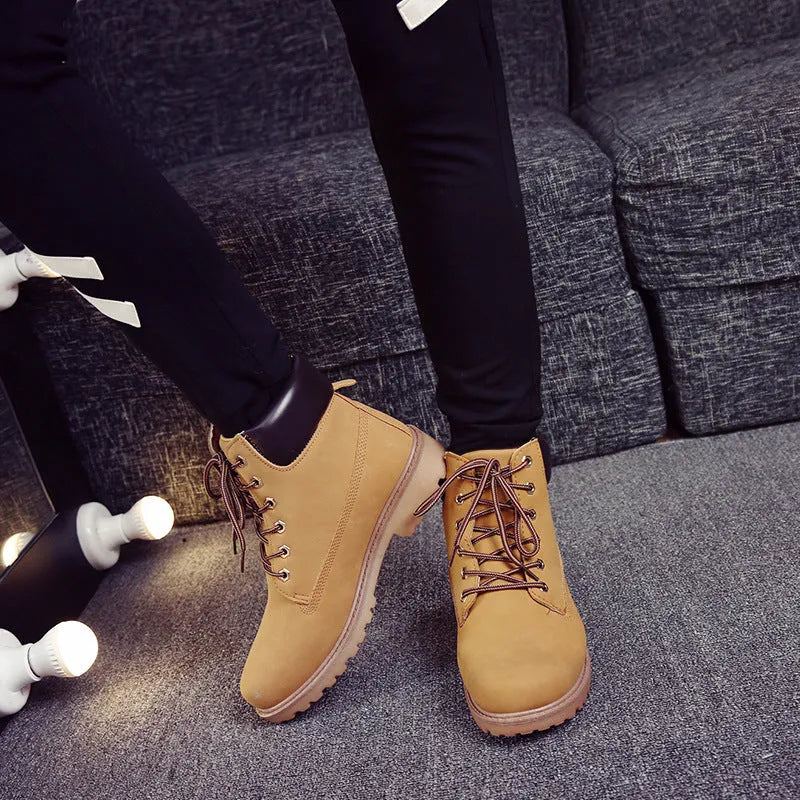 Martin boots with lace-up front, round toe and flat low heel in pink with velvet lining