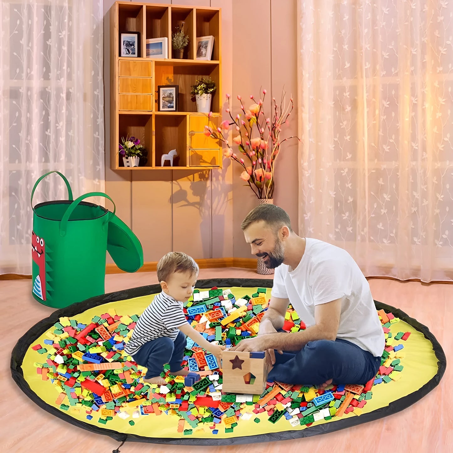 Green felt storage cube with pull rope unfolded flat to show 35cm square waterproof play mat