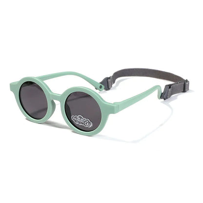 Children's round-frame polarised sunglasses with soft TPEE frame for ages 0-3, shown in assorted colours.