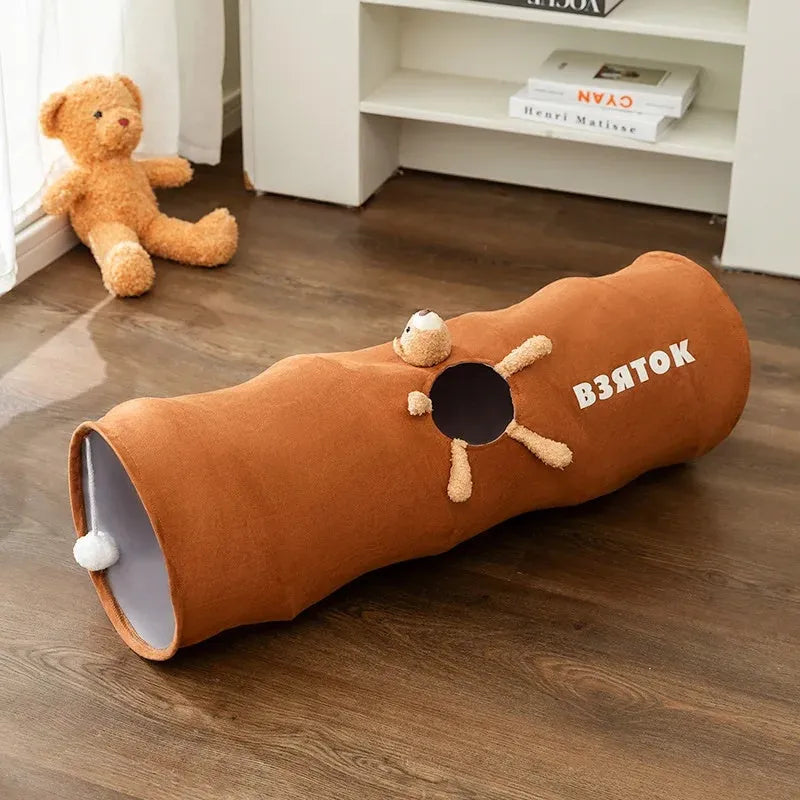 Collapsible cat tunnel in grey with attached plush ball, showing folded and extended positions