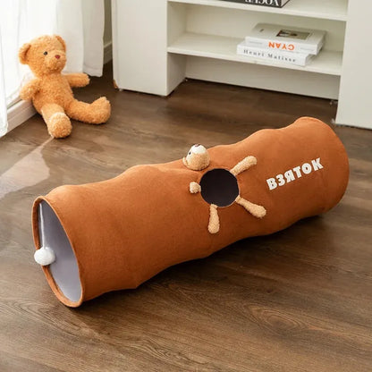 Collapsible cat tunnel in grey with attached plush ball, showing folded and extended positions