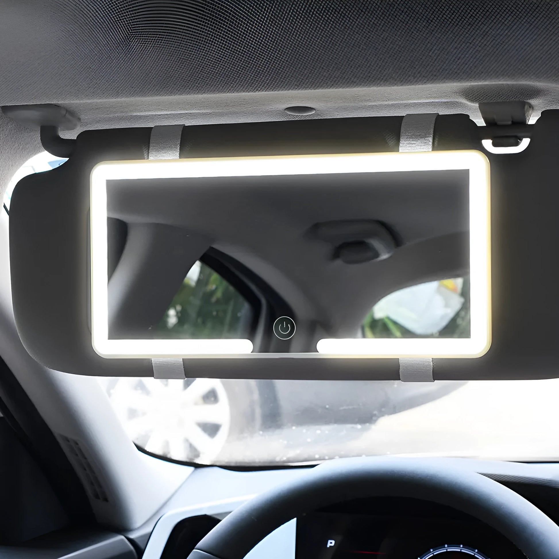Automotive LED makeup mirror mounted on a car sun visor, showing its slim profile and large reflective surface.