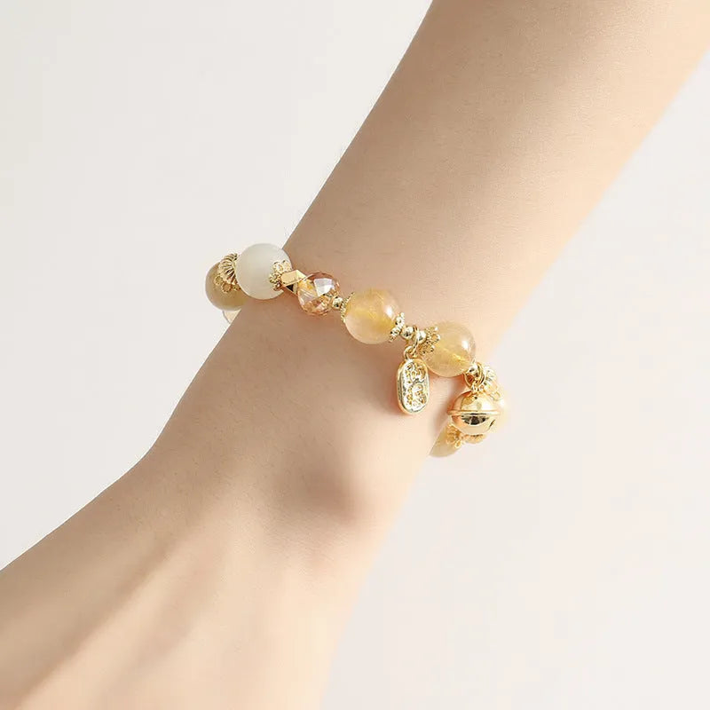 Gold electroplated bracelet with a rutilated quartz charm in Lucky Fortune colour.