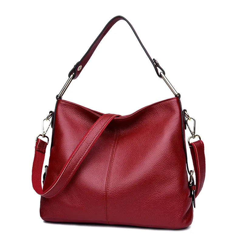 Black genuine leather vertical crossbody bag with multiple internal compartments and a sandwich pocket.