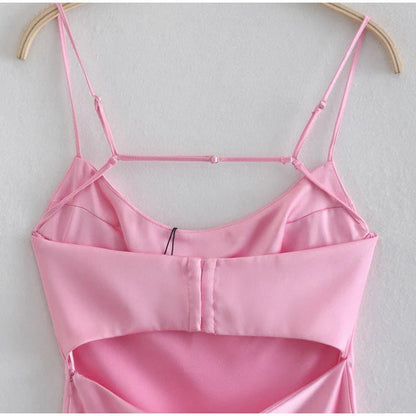 Elegant satin slip dress in pink with a square neckline, sleeveless design, and backless detail