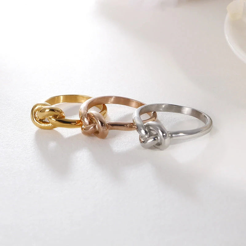Elegant Truelove Knot Titanium Steel Ring in gold and rose gold finishes