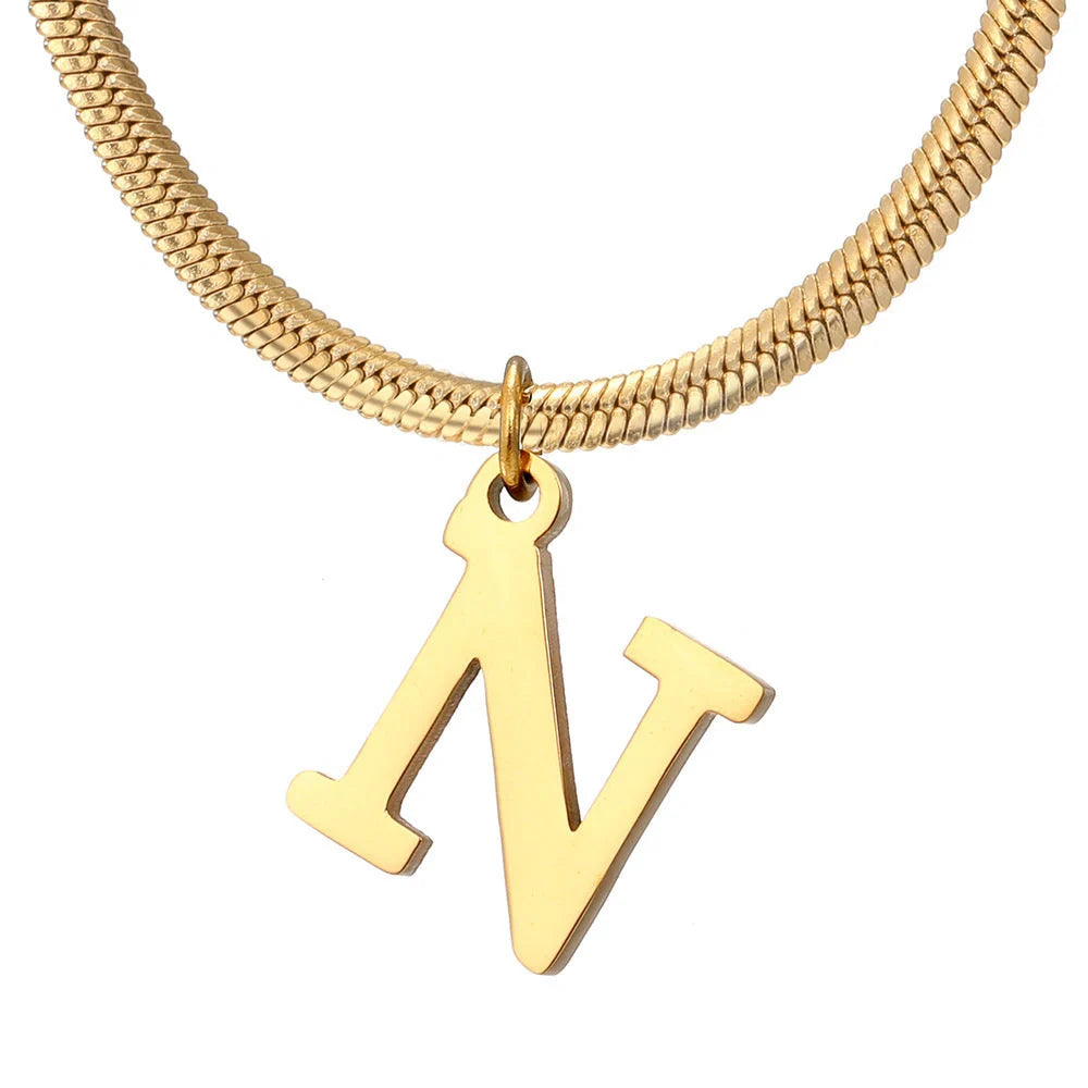 Elegant gold A-Z letter pendant necklace on a snake chain