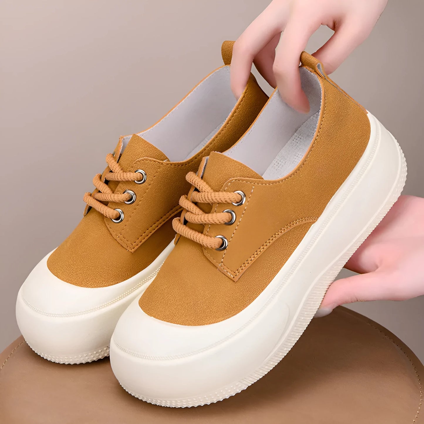 Women's camel suede platform loafers with round toe and front lace-up on a 4cm flat rubber sole.