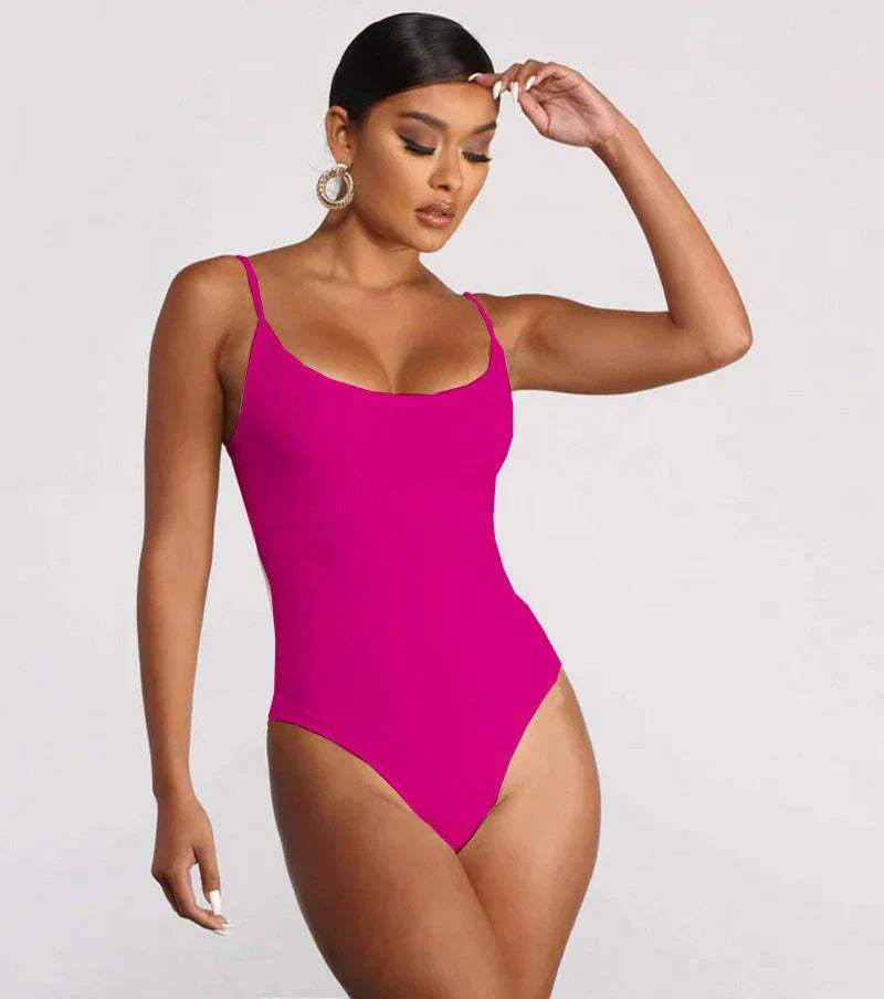 A stylish, backless one-piece swimsuit in a variety of vibrant colors for women's summer fashion.
