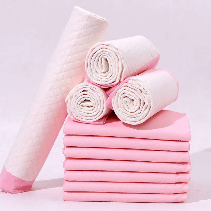 Pack of disposable pet urinal pads showing layered construction and size options S, M, L, XL for dogs and cats.