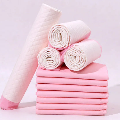 Pack of disposable pet urinal pads showing layered construction and size options S, M, L, XL for dogs and cats.