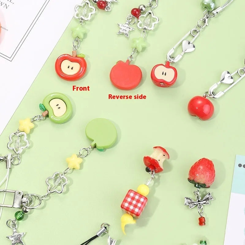 Plastic and resin fruit charm keychain with apple, strawberry designs on silver rope