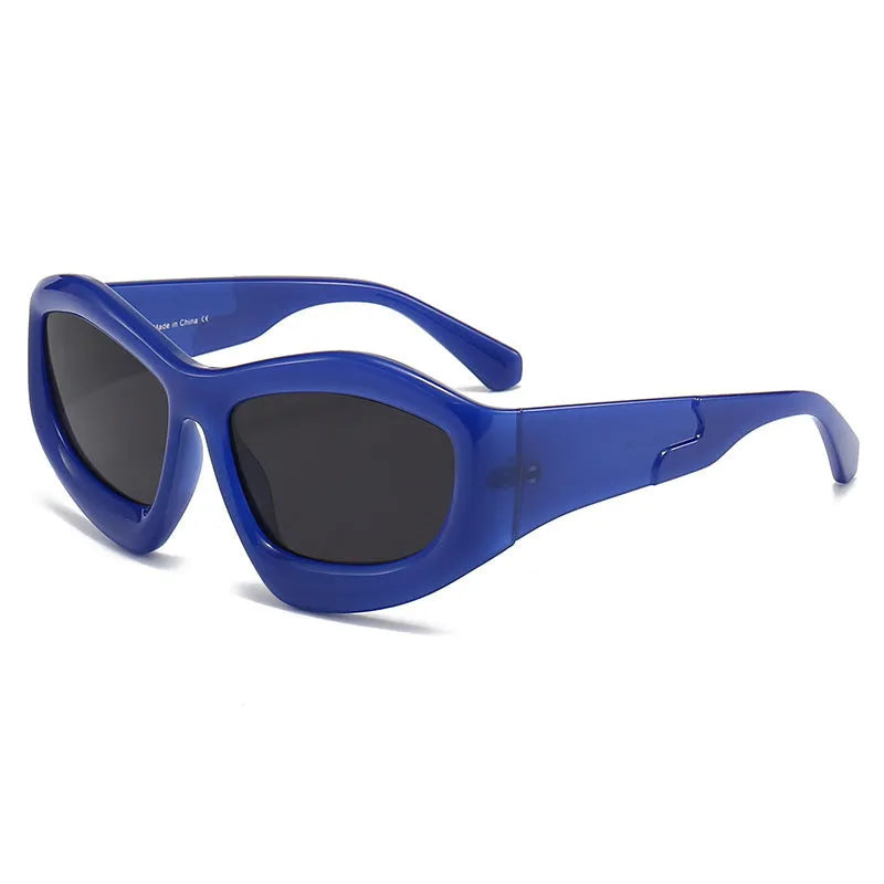Outdoor unisex sunglasses with concave bubble lenses in black frame on a table.