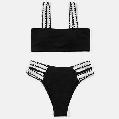 Black women's hollowed-out split swimsuit bikini set on a model.